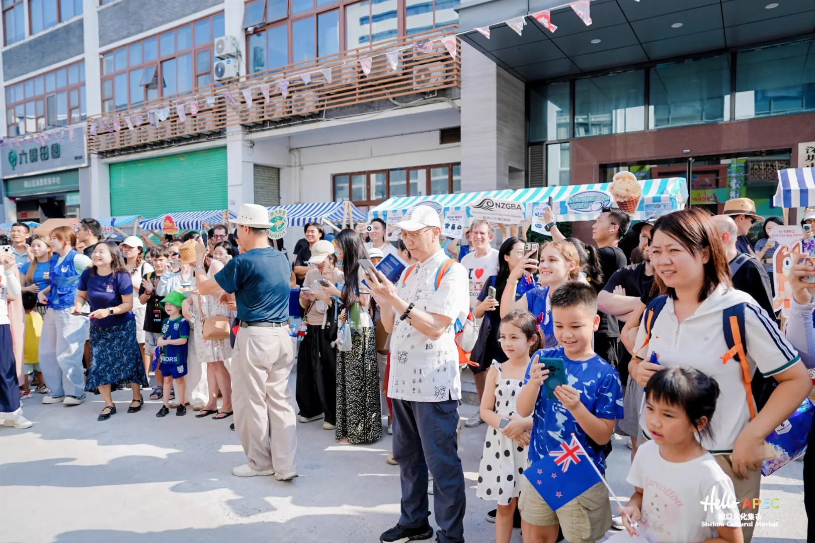 Families and visitors watching a cultural performance