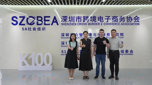 Group in front of the Shenzhen Cross-Border E-Commerce Association display