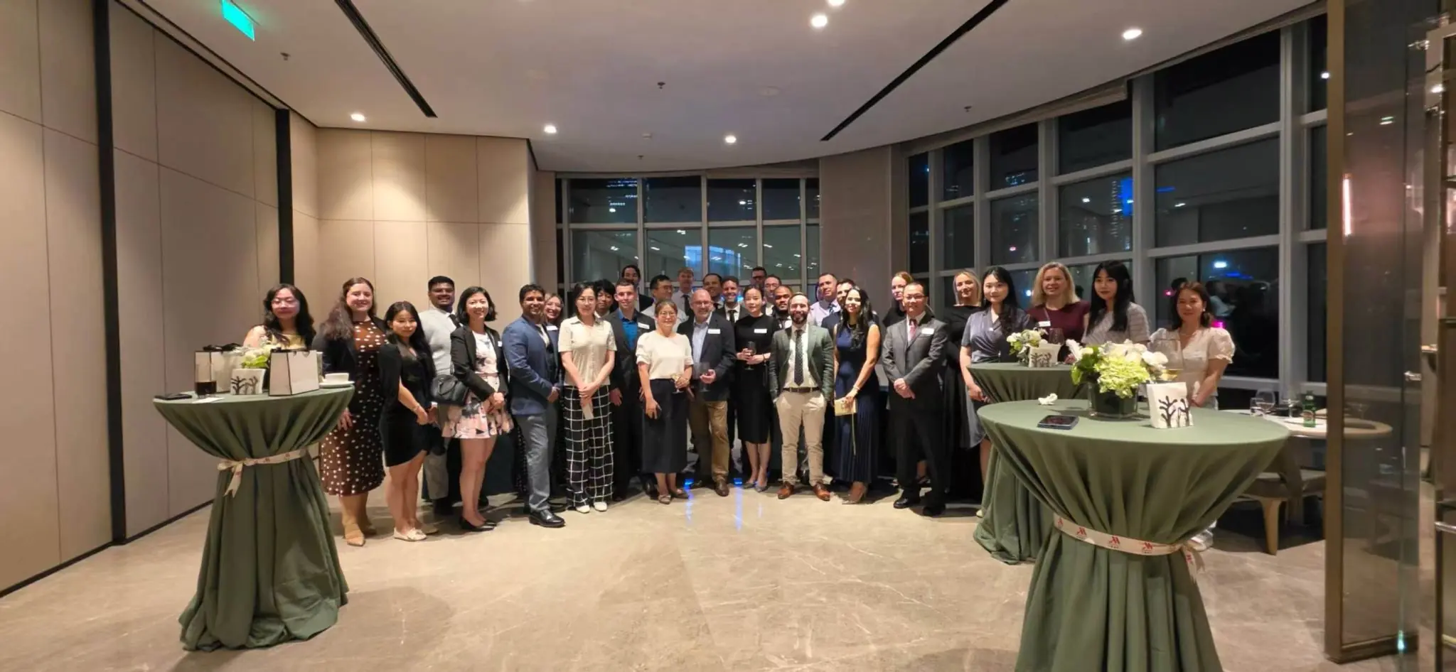 Group posing in an indoor event space